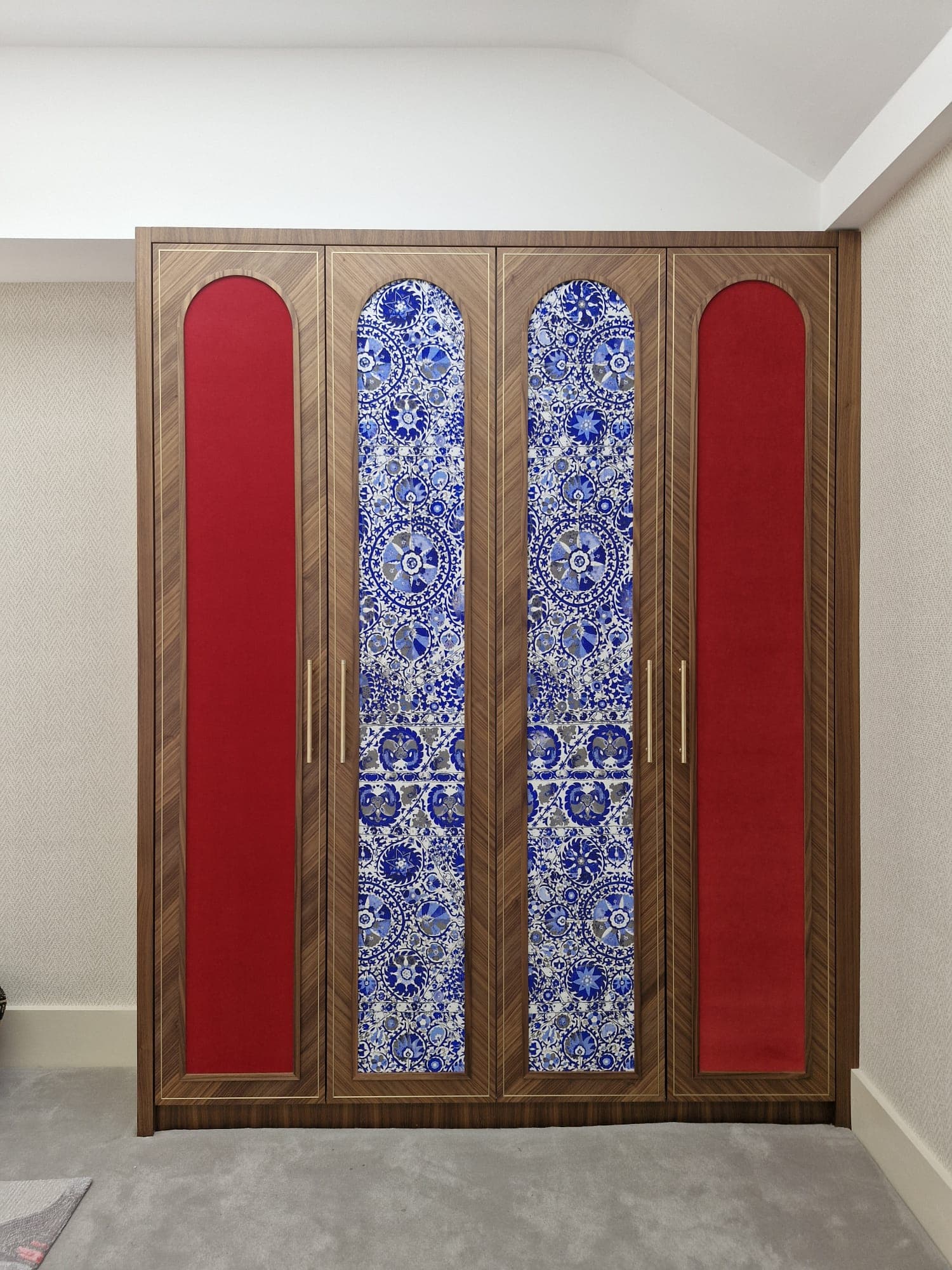 Fitted wardrobe with patterned panel doors
